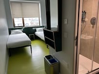 Private small bathroom with shower. Two towels included. Mirror and dressing table too.