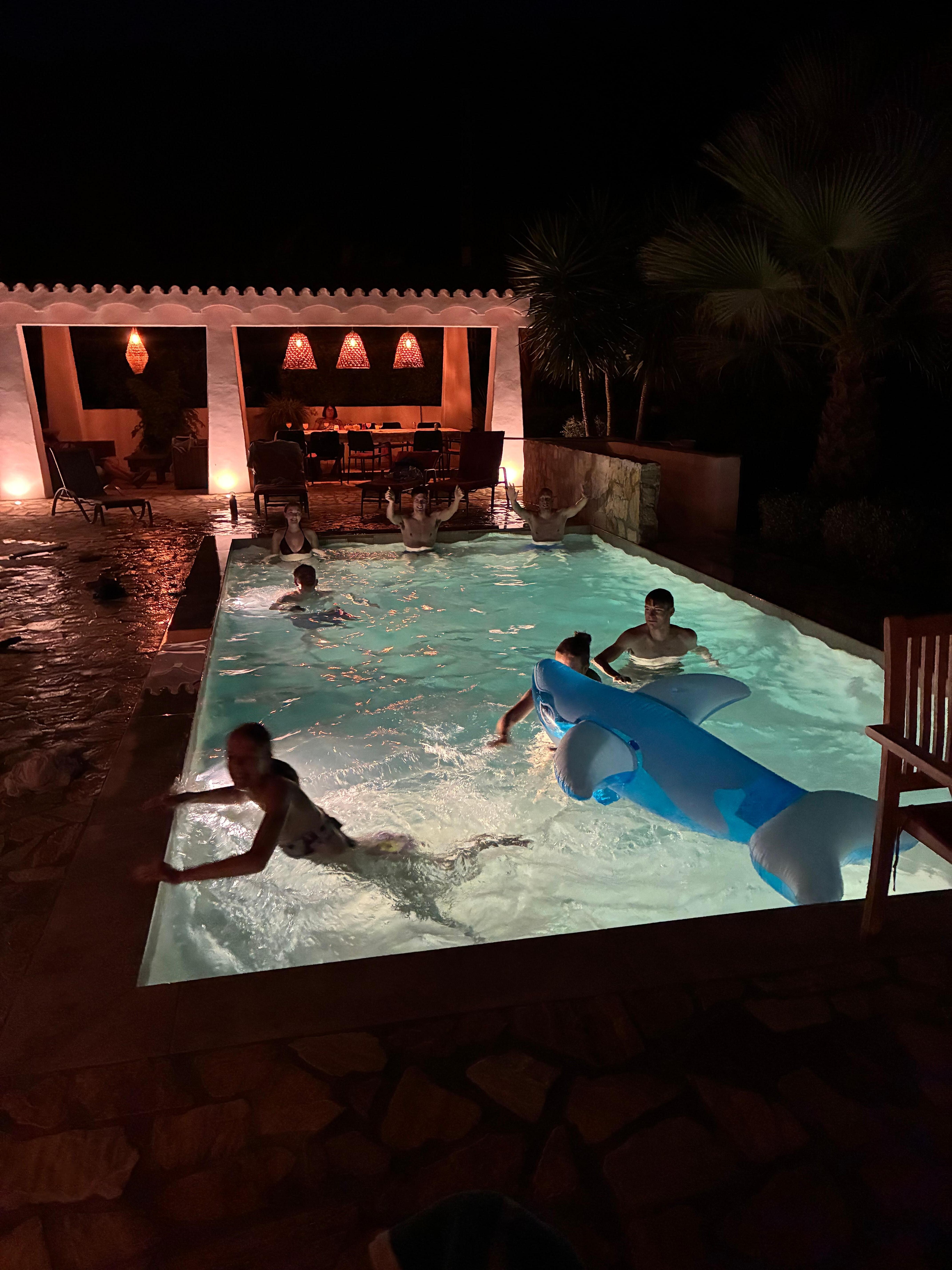 Pool area lit in the evening 