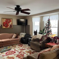 There is another recliner couch to the left in the comfortable living room.