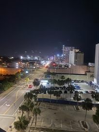 Balcony view late nite looking toward downtown and Ferris wheel