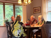 Cousins visiting in the dining area.