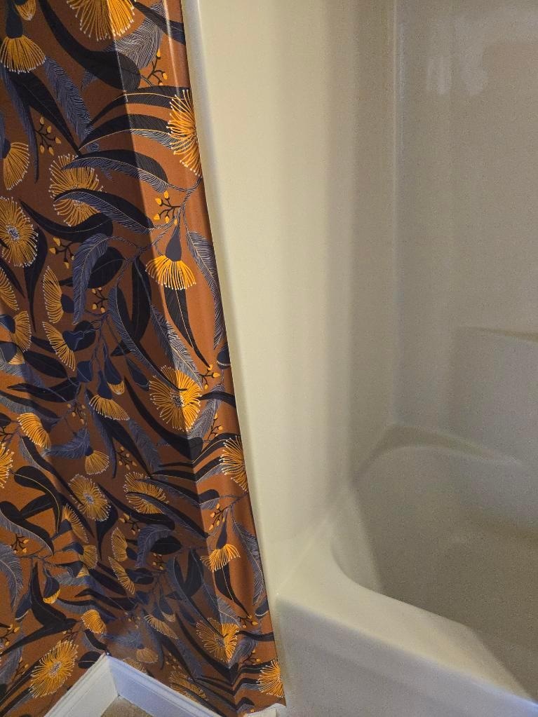 Peeling wallpaper in bathroom.