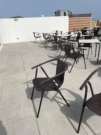 this is a real photo of the roof area - their photo is fake. depressing and unwelcoming space