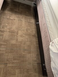 The bed frame had 3 metal spikes sticking out, which scratched both my wife and my dog.