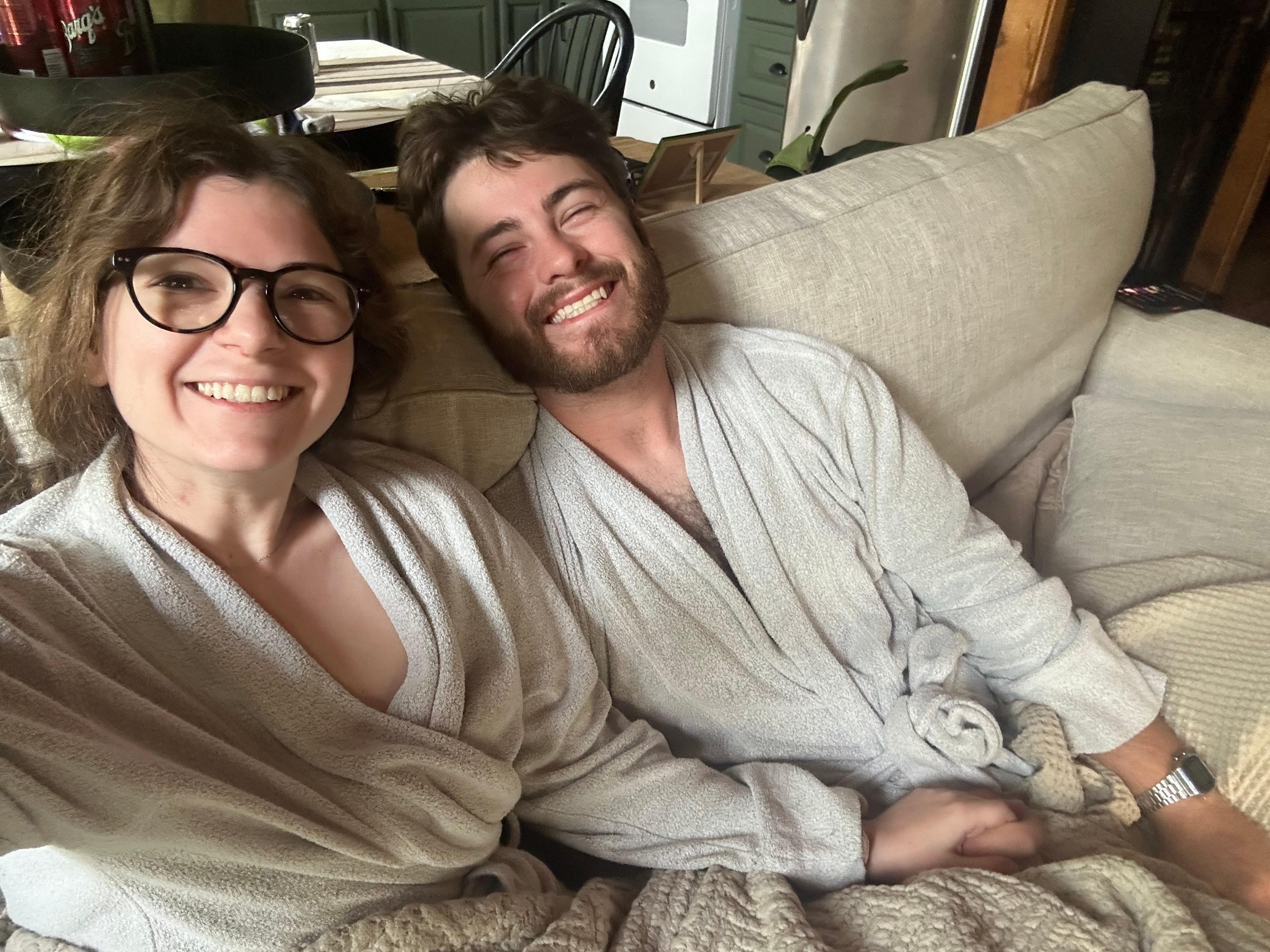 Watching Annie with breakfast in the provided matching bathrobes. 