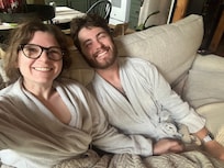 Watching Annie with breakfast in the provided matching bathrobes.