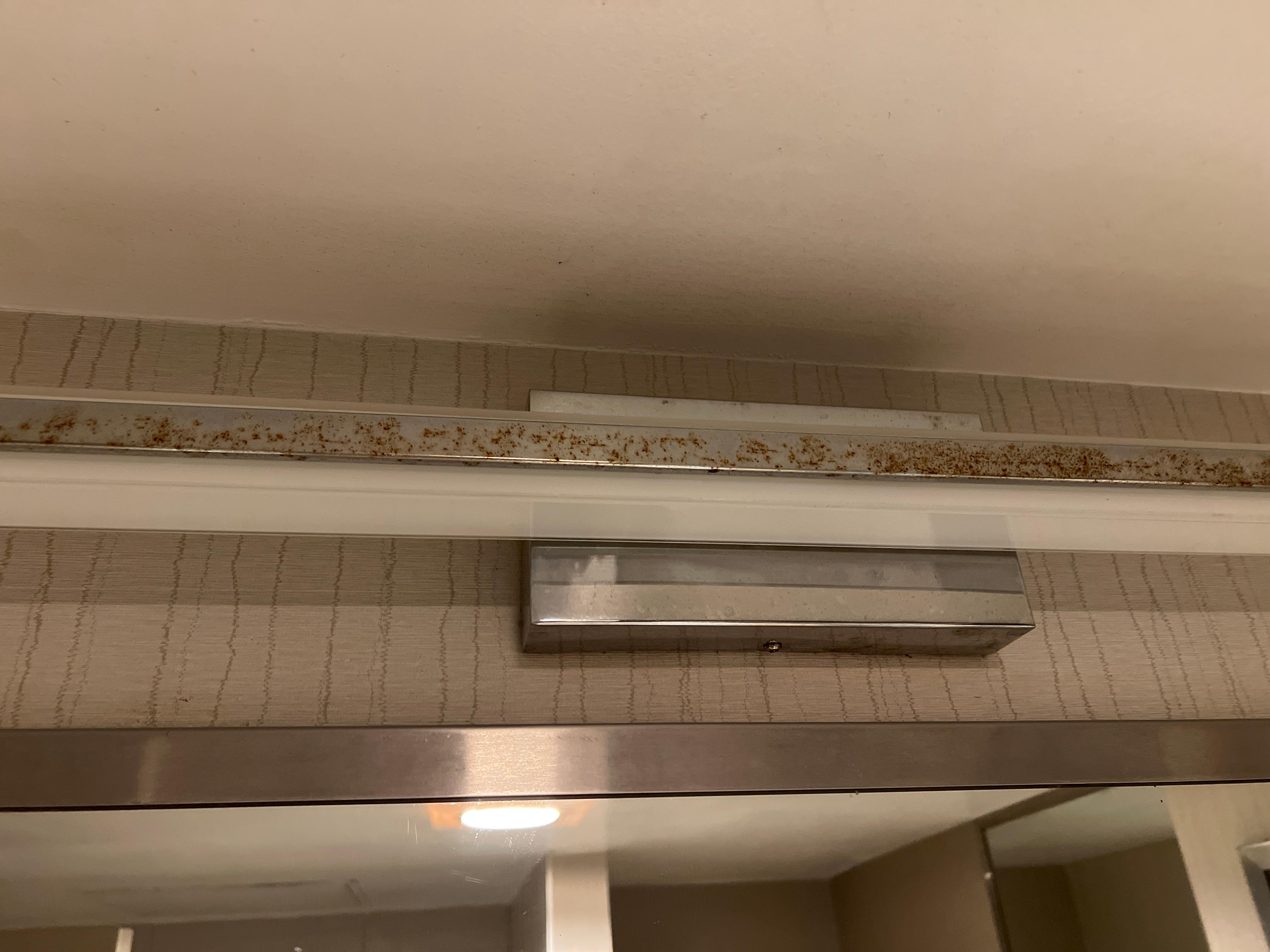 Nicotine stains on light fixture in bathroom 