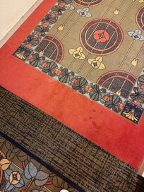 The stained carpet in the hallway. They actually look worse in person than in this picture.