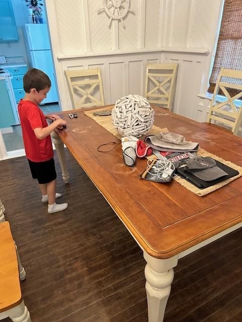 Dining room w/ 6-person table for eating (or playing Hot Wheels)