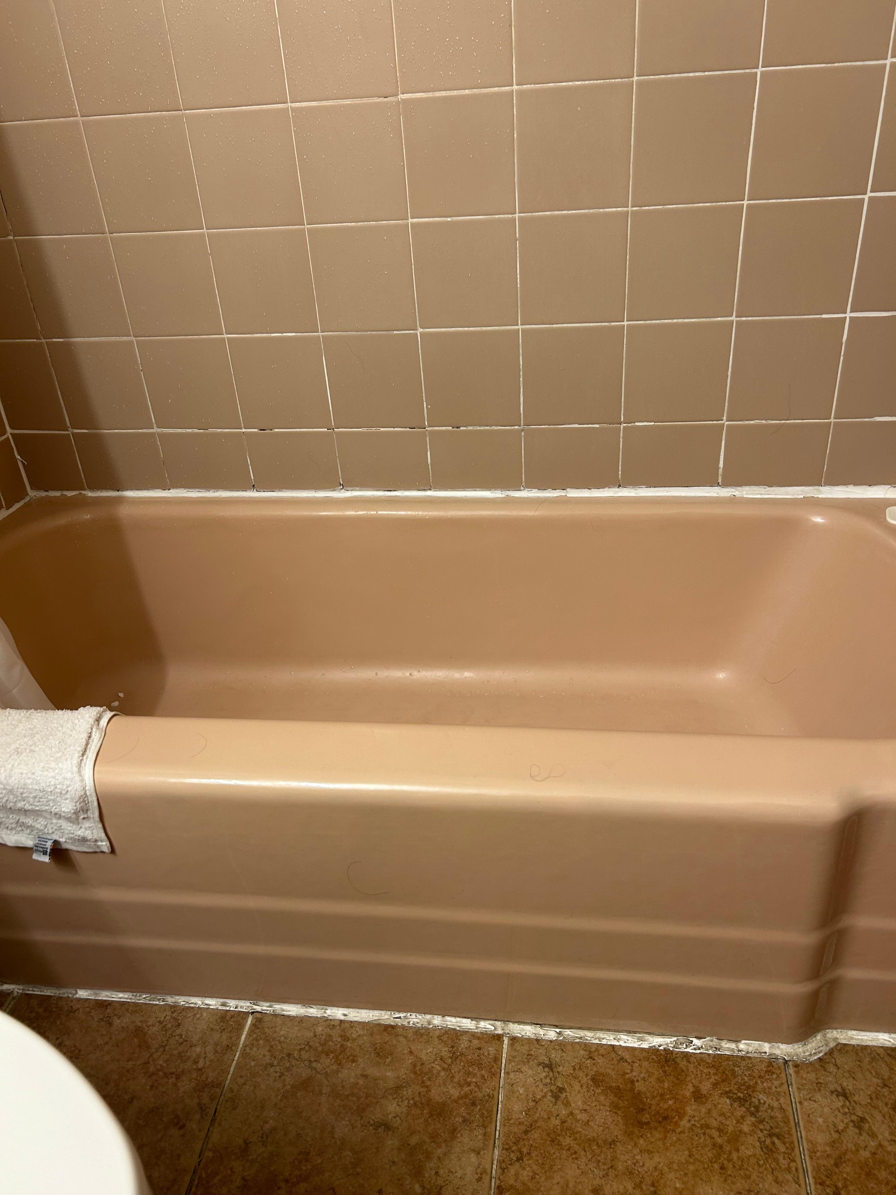 Tub had lots of soap scum.  Caulk around bottom of tub was black.