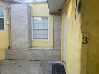 Photo walking through garage/laundry area to door.