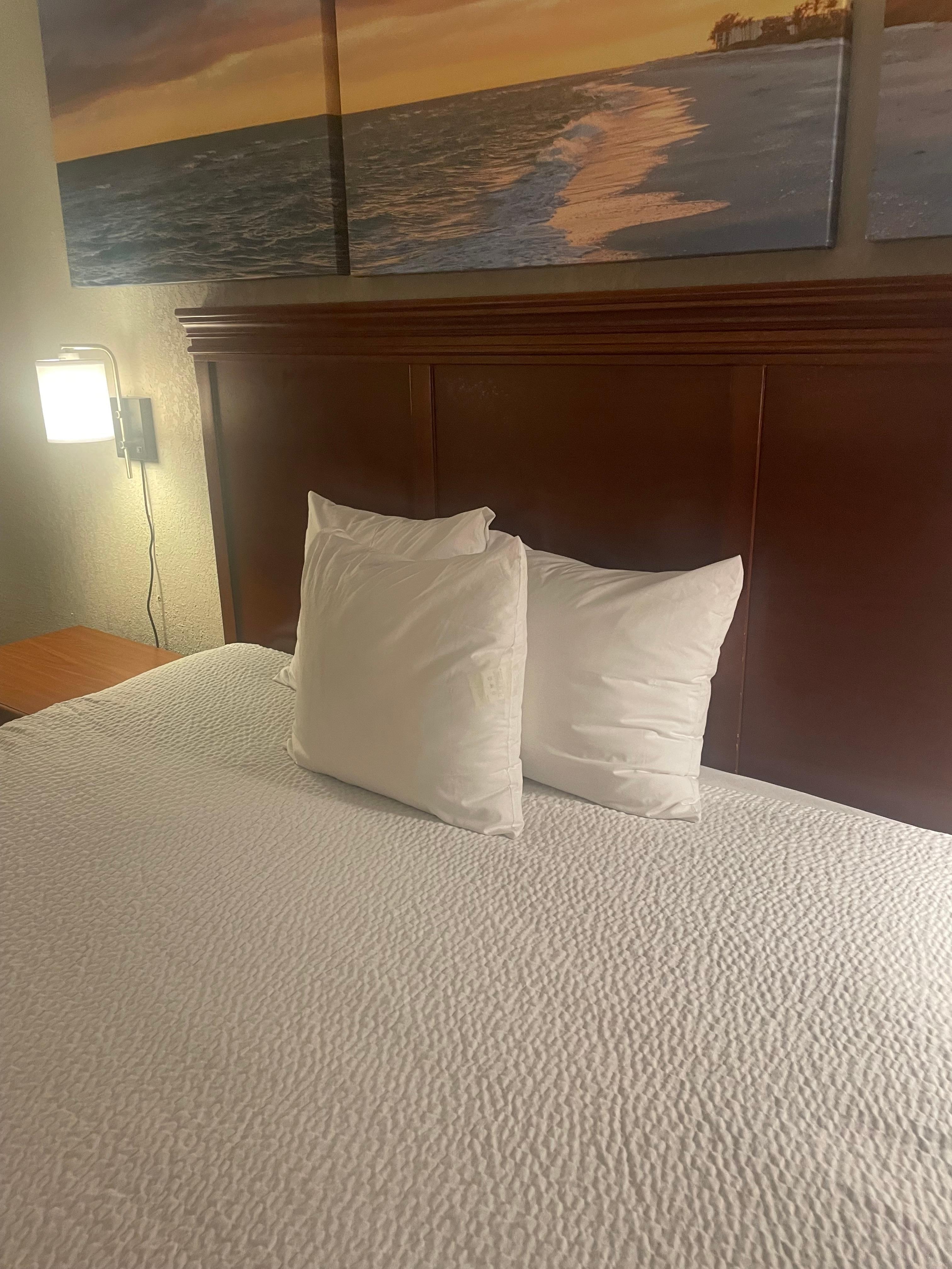 Only 3 miniature pillows for a king side bed. 