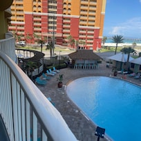 View from the condo deck looking over the pool towards the ocean.