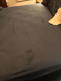 Stained bedsheet. Owner agreed this was unacceptable offered to provide new sheet.