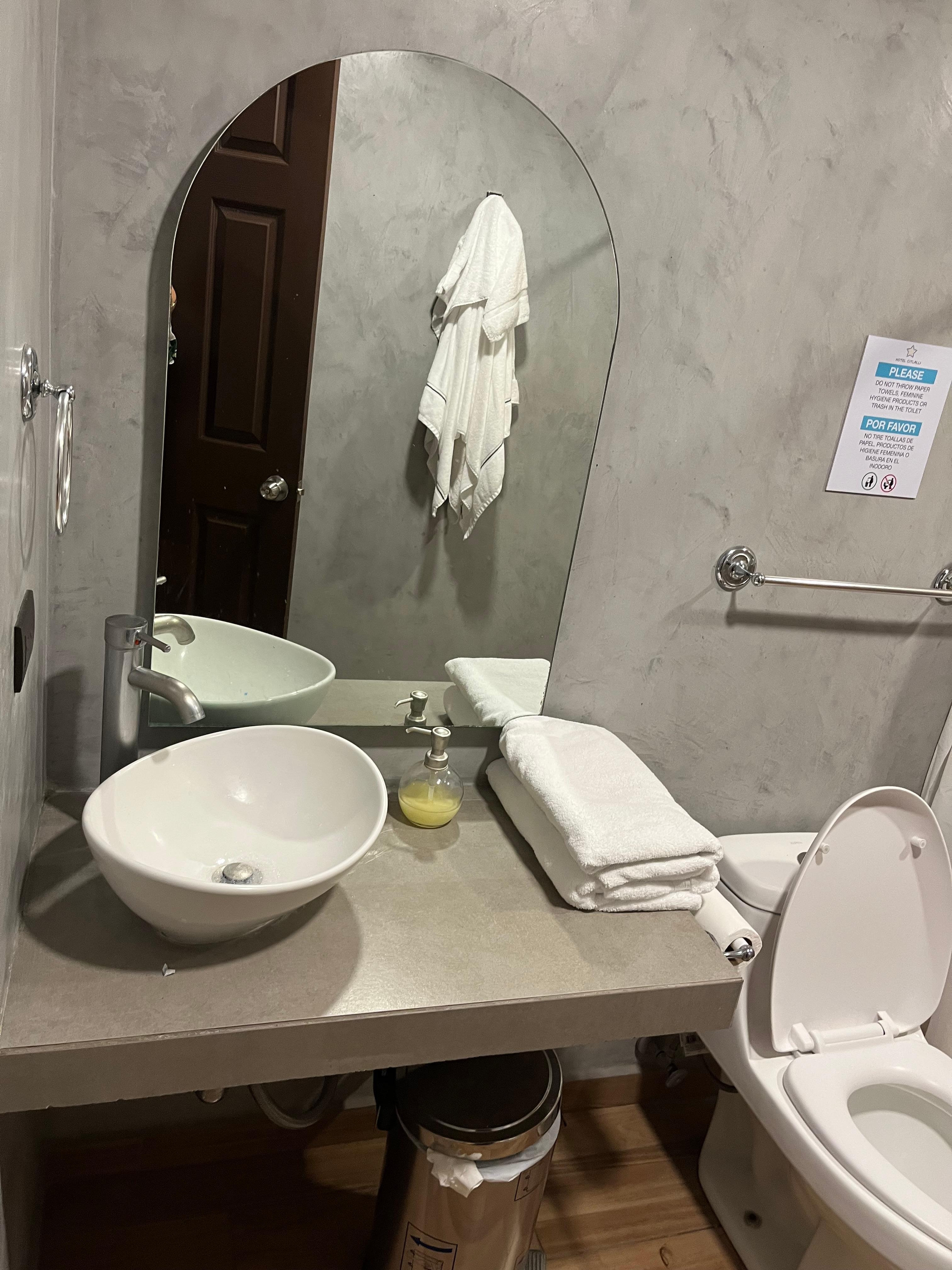 Clean bathroom with great towels . 