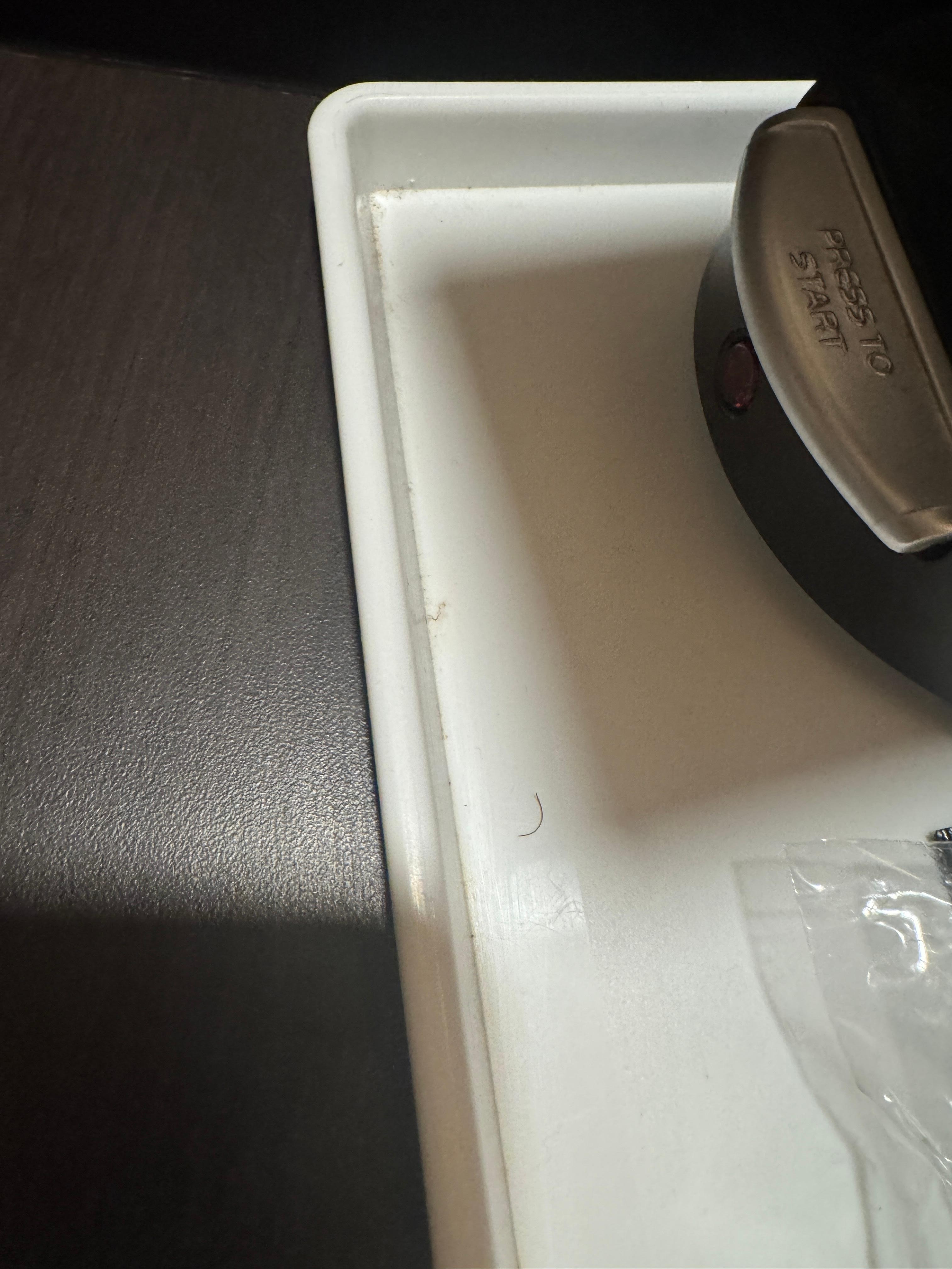 Pubic hair at coffee maker!