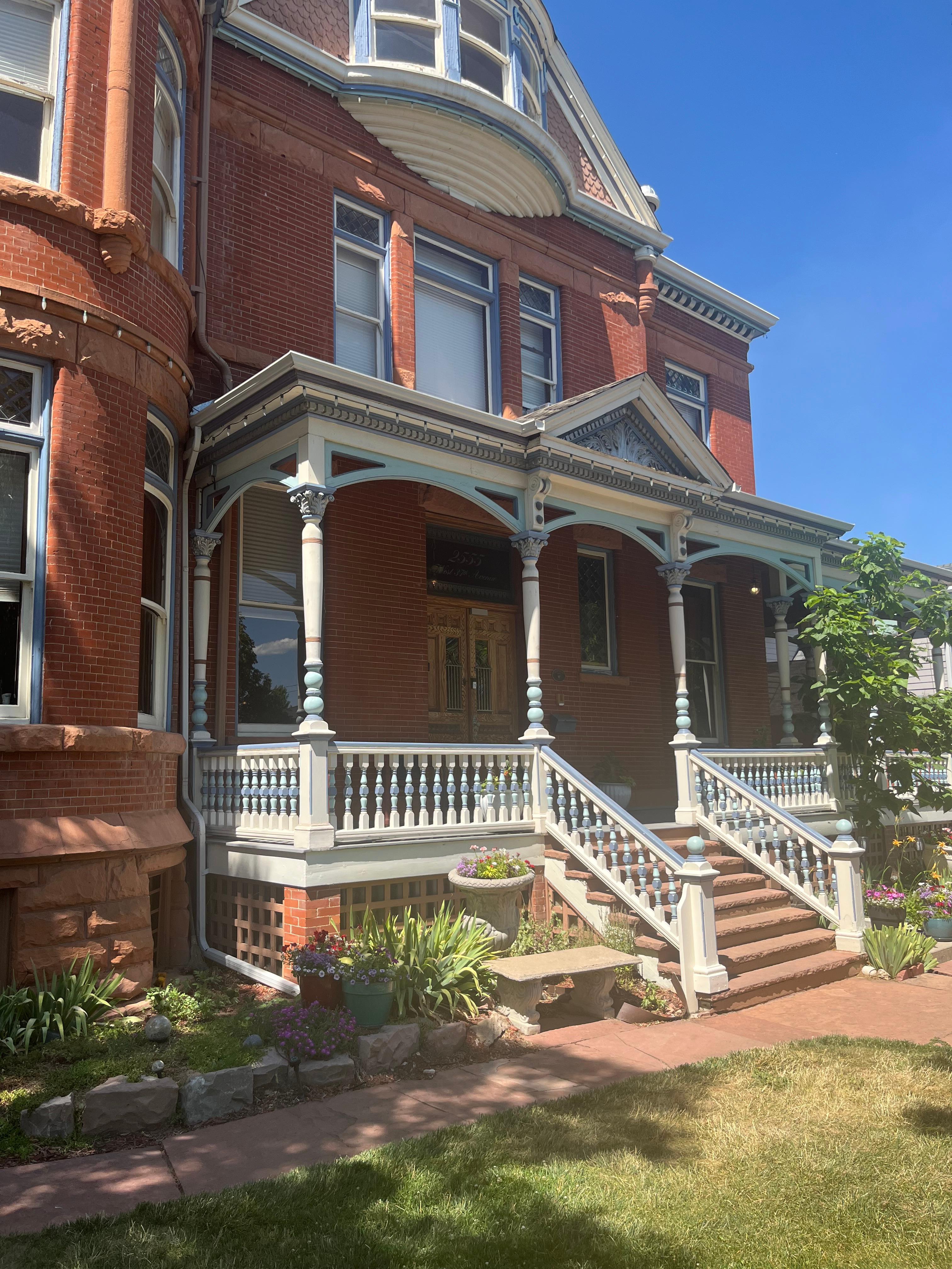 Imposing facade behind well-kept flower gardens 