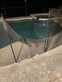 Broken gate to pool area.