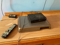 Tv device screwed to cabinet