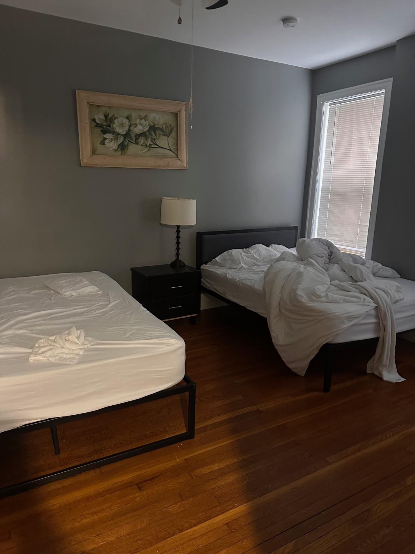 Bedroom #2 with unmade beds