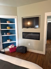 Bedroom tv and fireplace