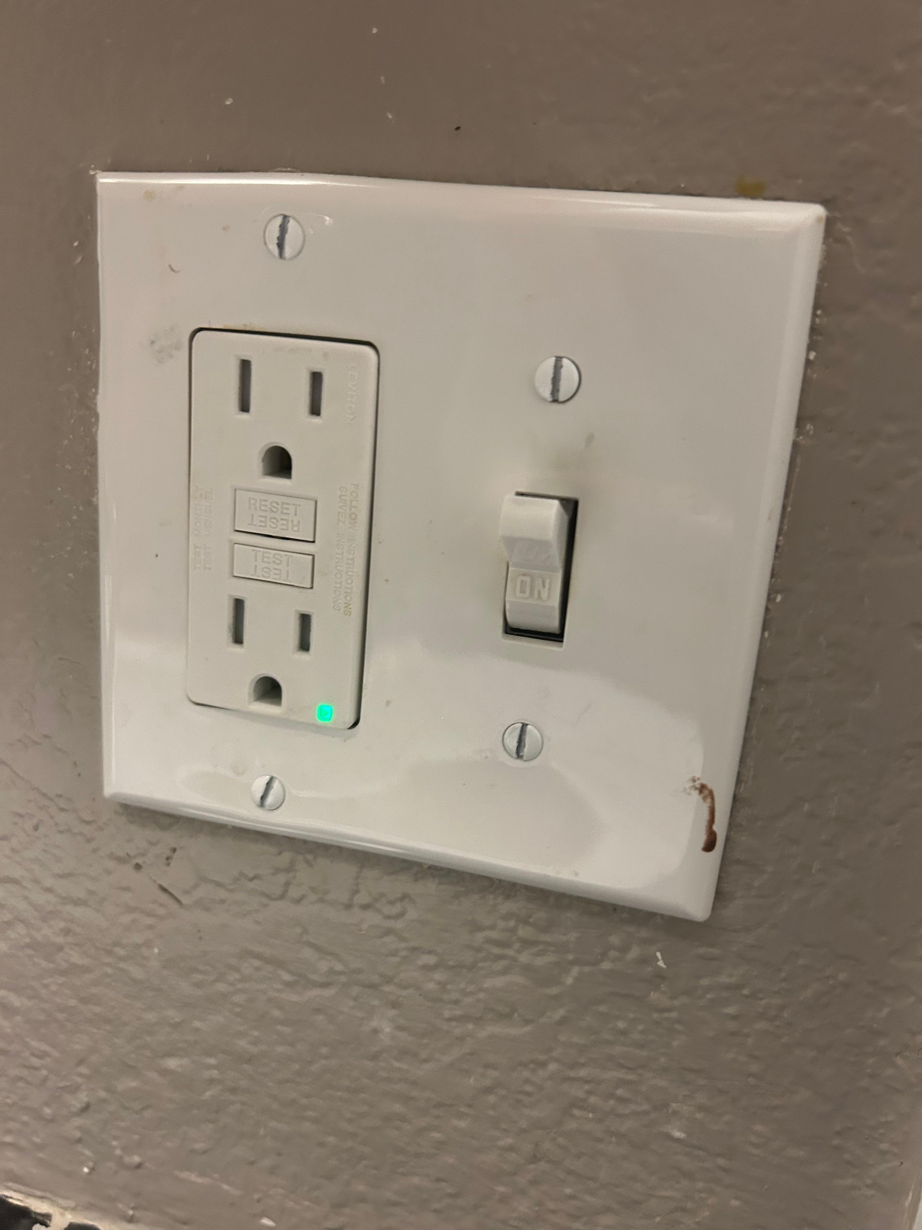 Blood on light switch in bathroom