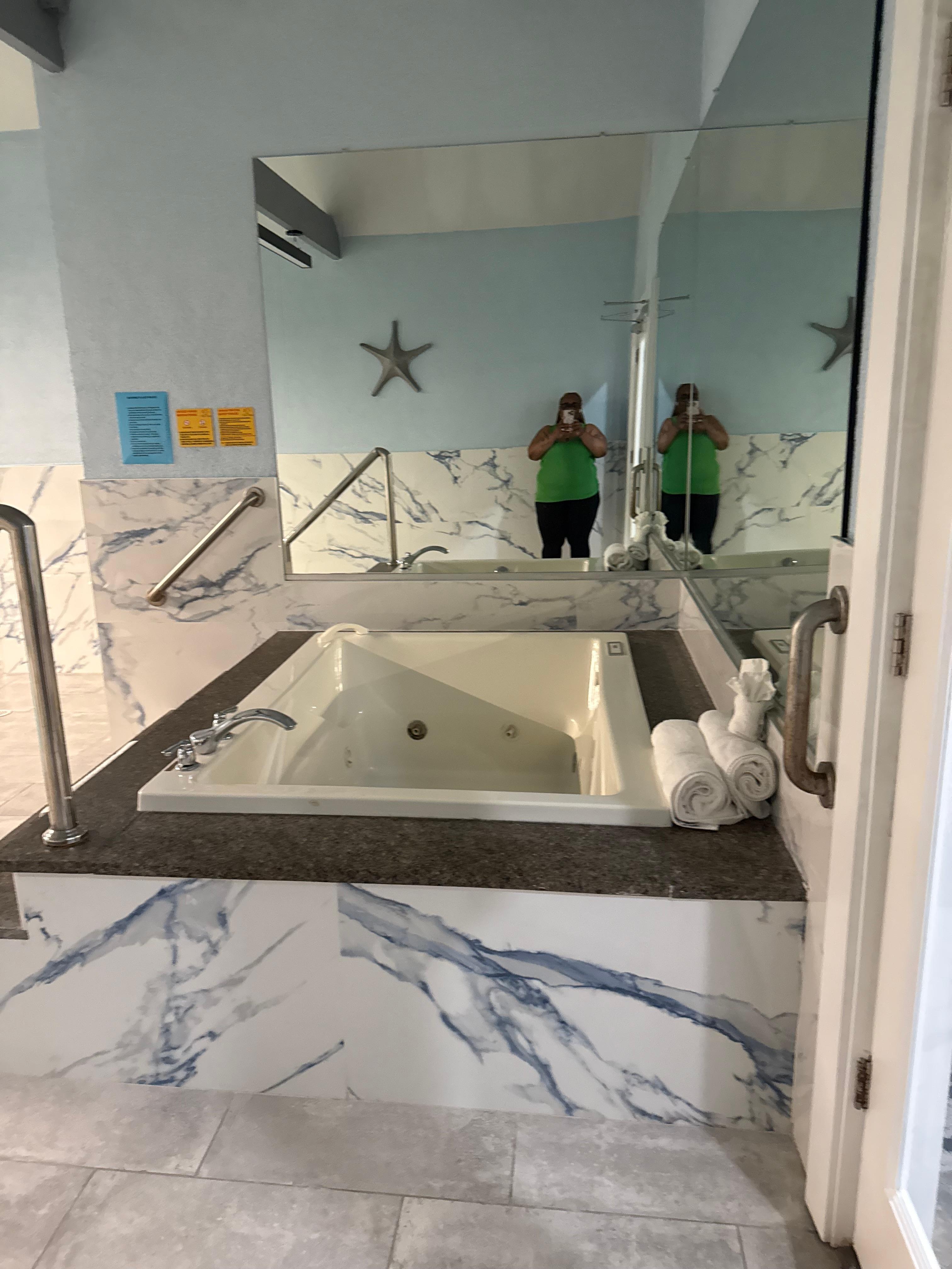 Jacuzzi tub in room also 