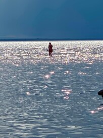 Walking on sandbar from property.