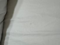 Another stain that we could rub off when touched, meaning the sheets were not washed.