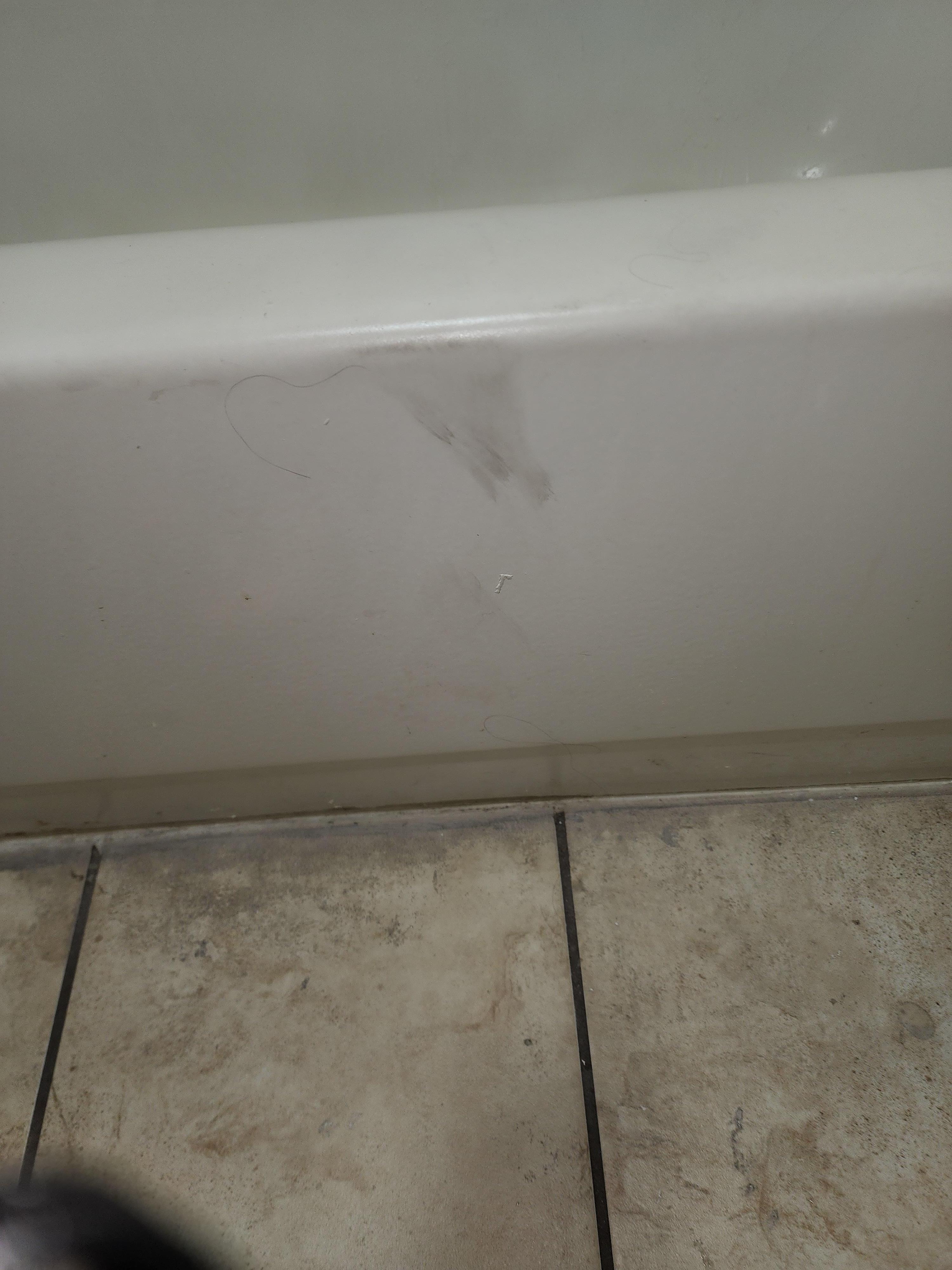 On the side of the bath tub