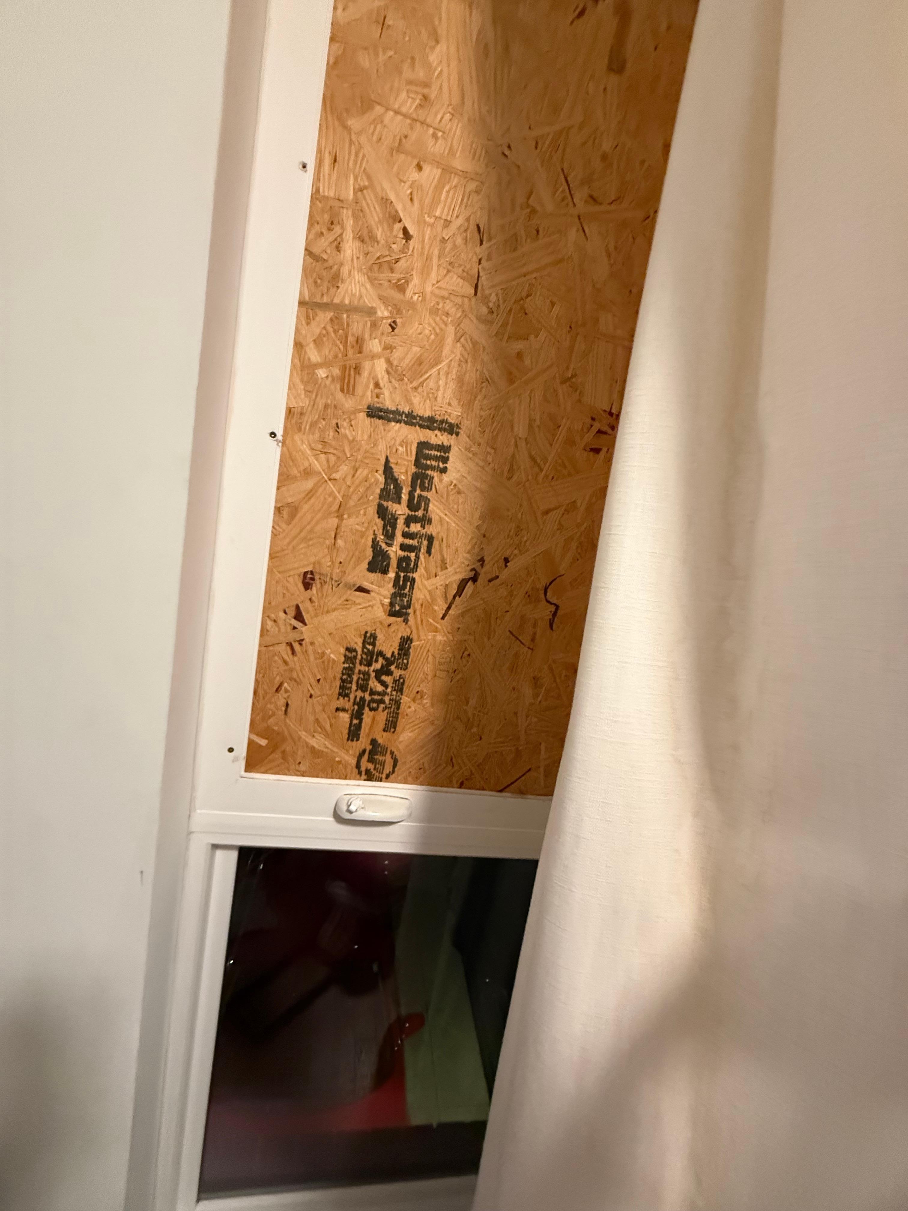 Boarded up window in the kids room.