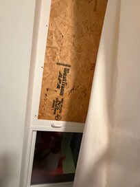 Boarded up window in the kids room.