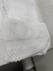 Dirty used towel upon check in