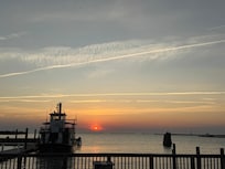 Cape Charles sunsets from Shanty Restaurant near by house