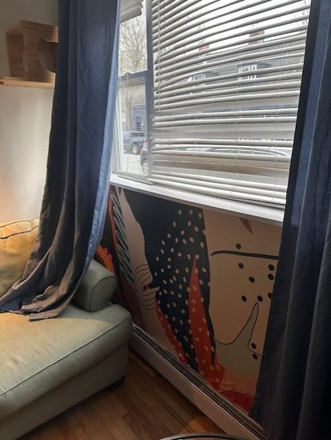 I wanted to pull up the blinds to let the light in and found this..... also note the wallpaper near the heater....