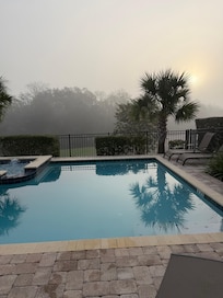 The pool looks over the golf coarse.