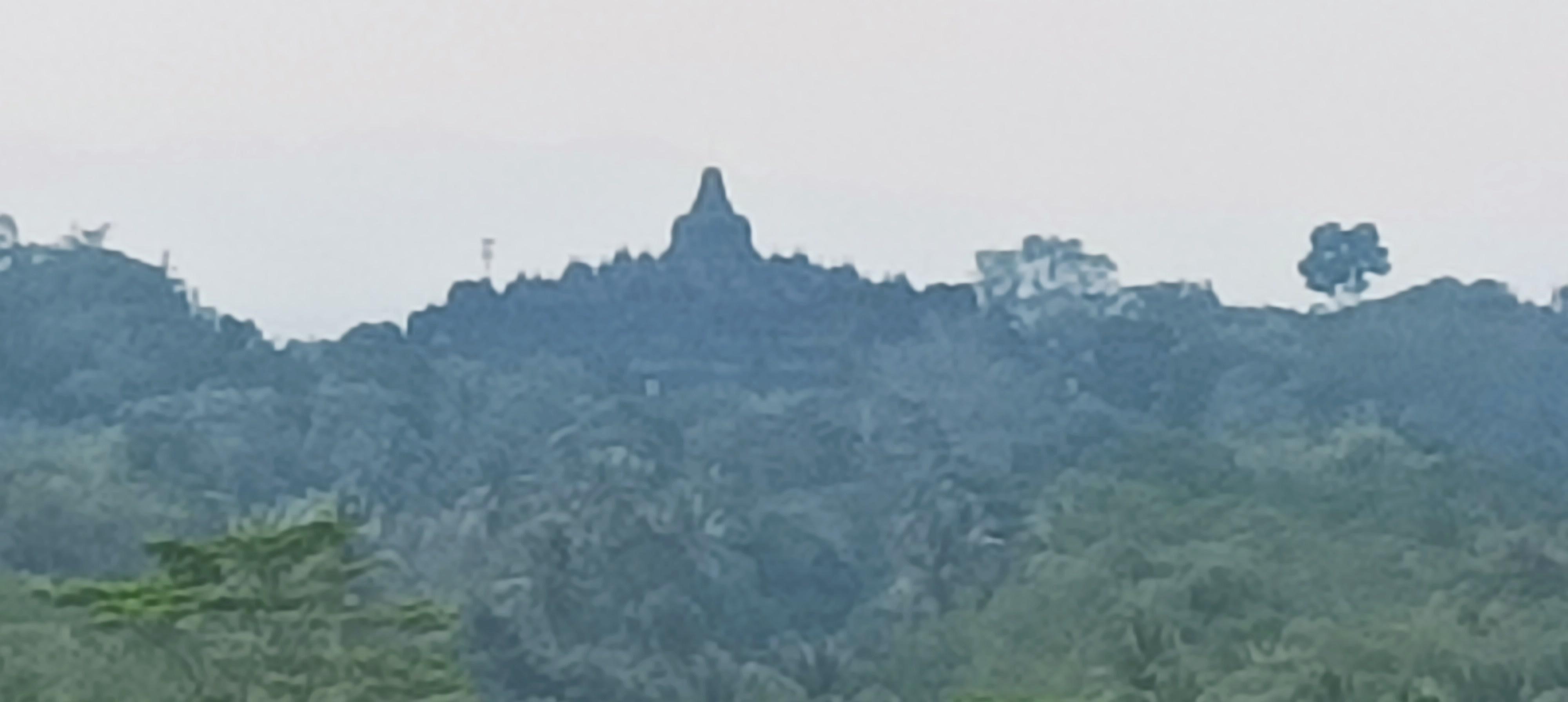 Borobudur at the far sight background