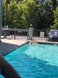 Kids acting like ‘beached whales’ on the top step of the pool.