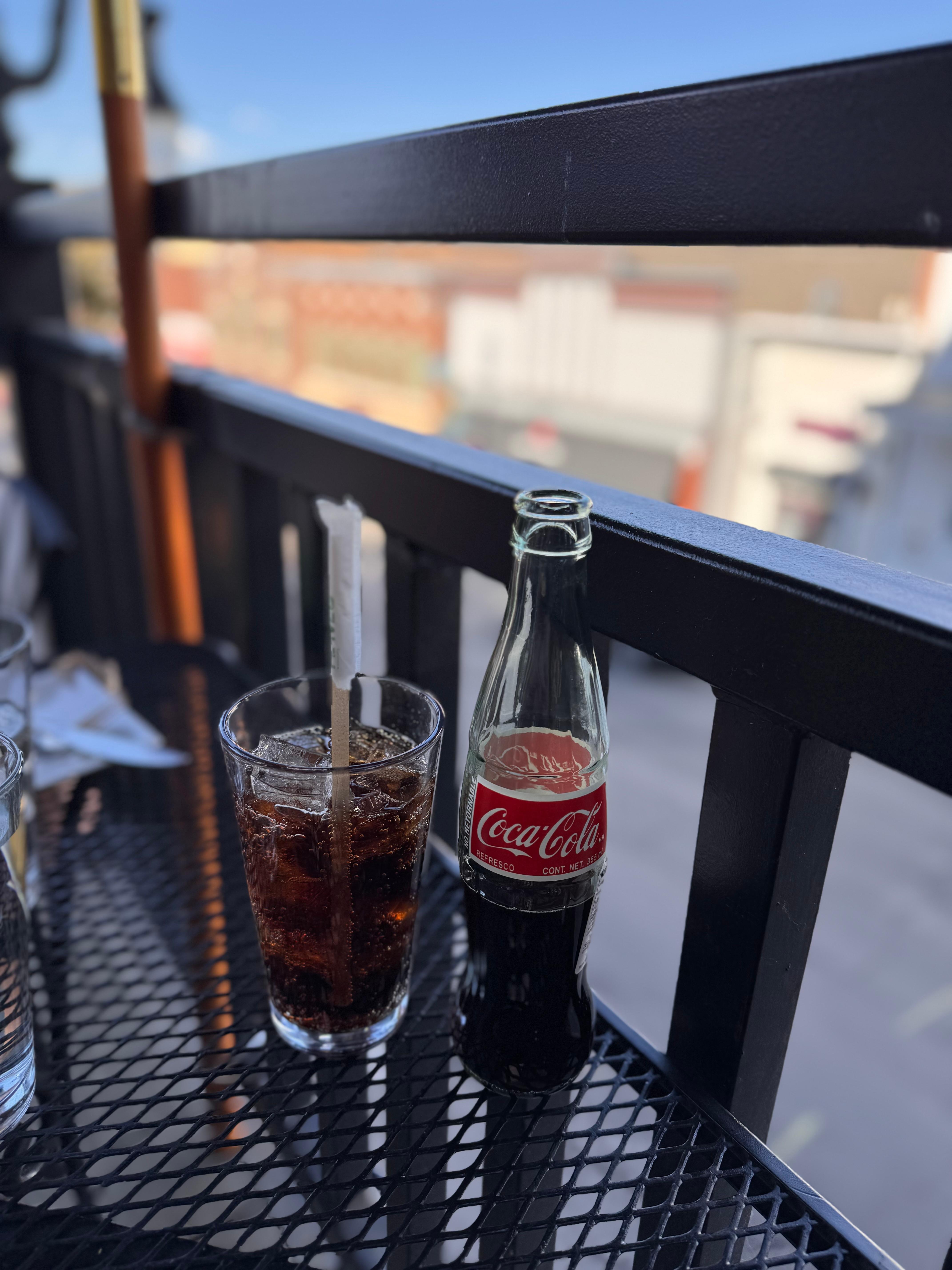 A coke and a smile on Main Street. 