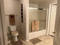 Large Bathroom with Closet. In the closet were items needed to go swimming, play all different sports around the complex.
