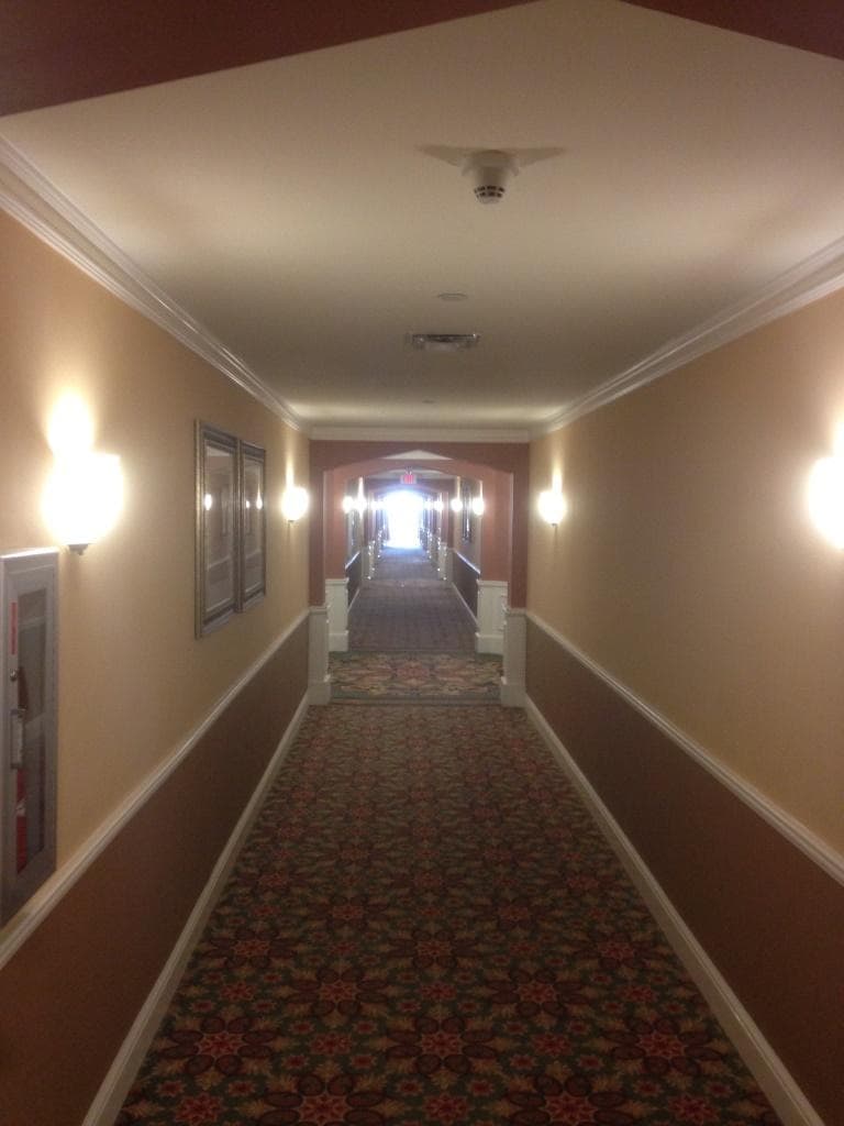 The elevator is at the far end..