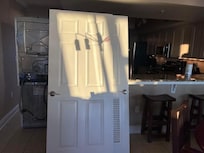 Doors removed in order to move washer and dryer