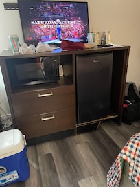 Furniture broken, tv propped up by power strip