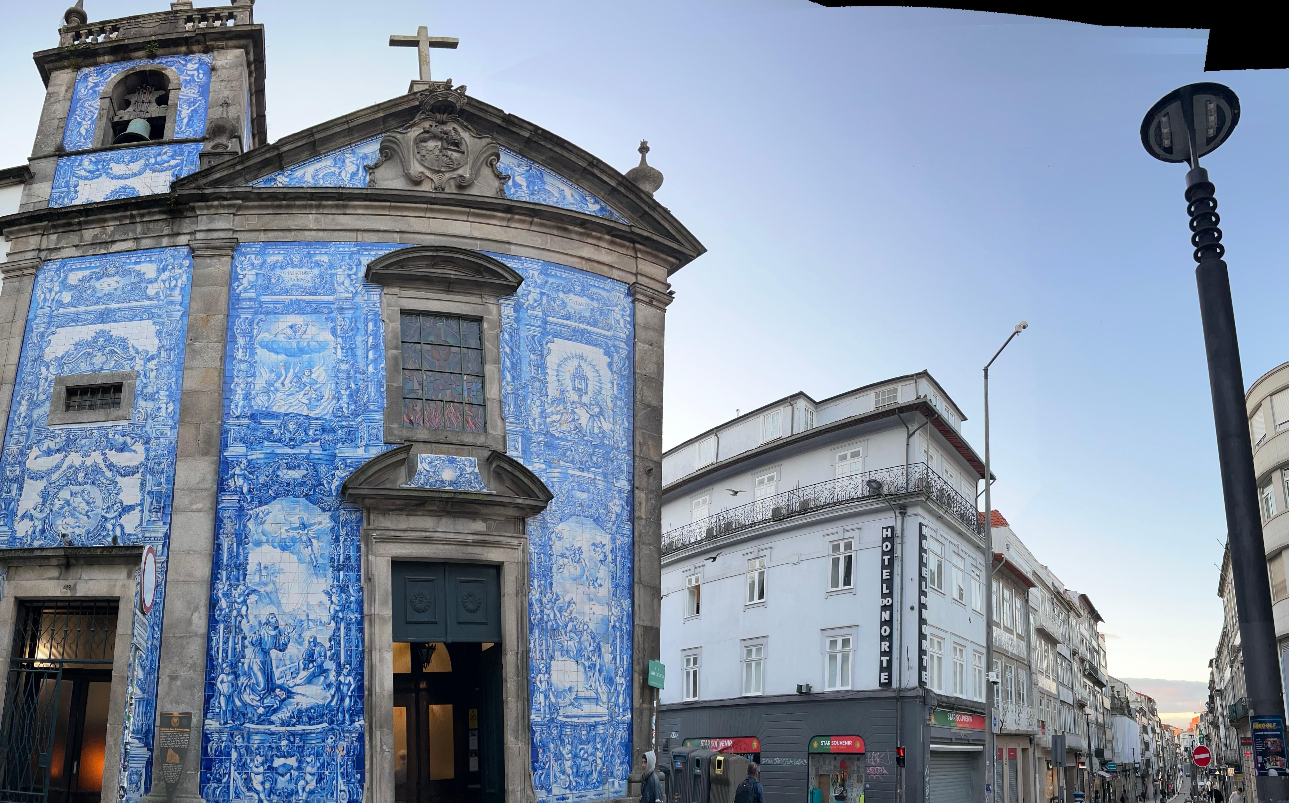 across the hotel is a church with tiles on its exterior 