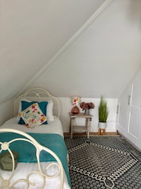 Single bed in family room.