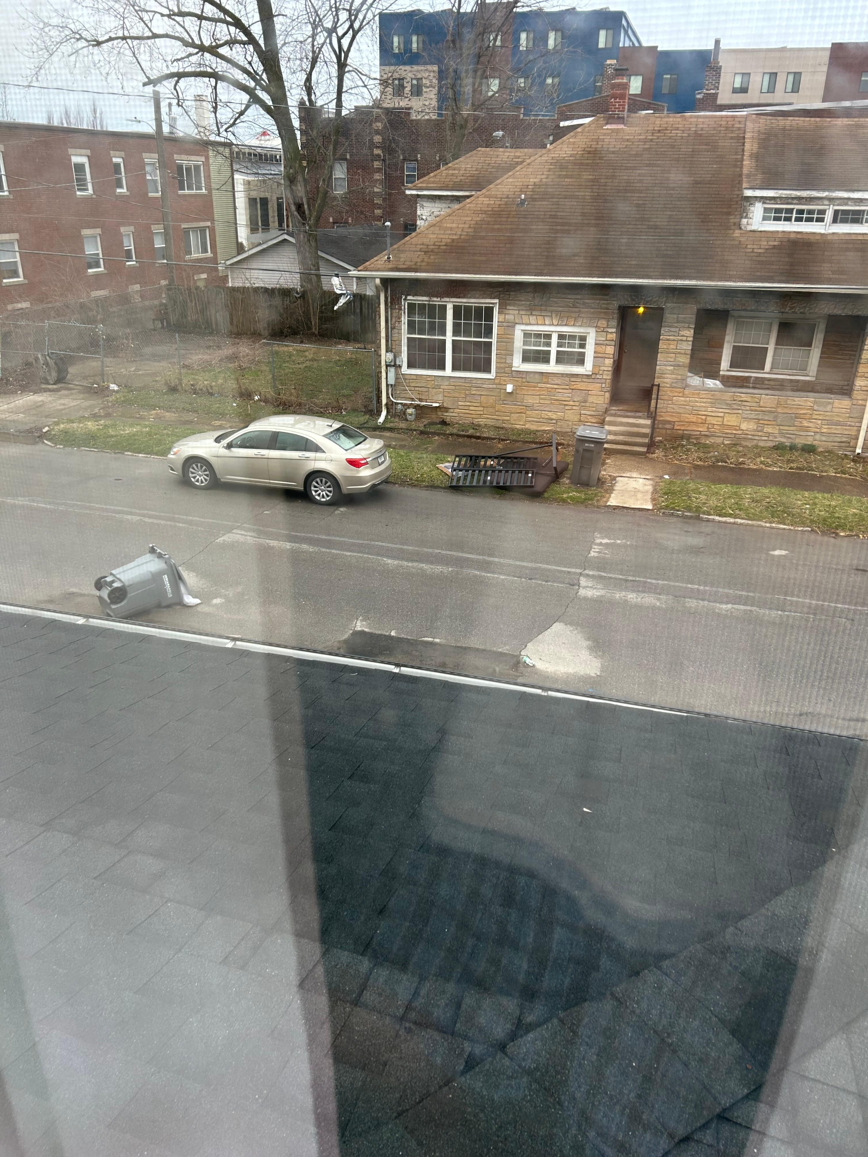 Out a bedroom window   Yes sneakers hanging from power lines. 