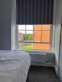 Sash window for ventilation and blackout blinds.