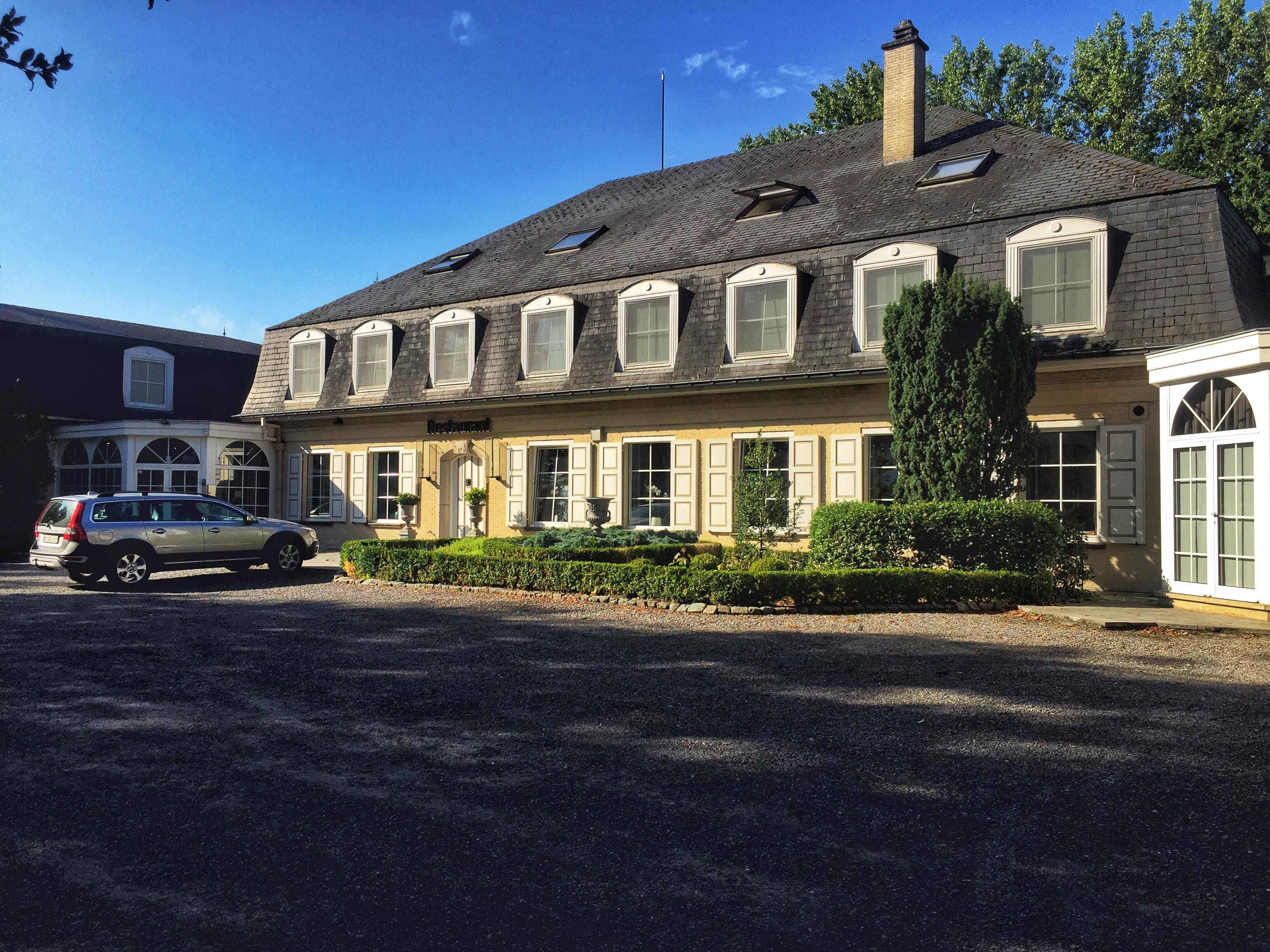 The main building, and large parking area. 