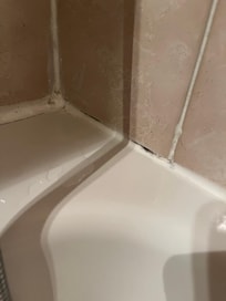 The tiles in the bathroom were black