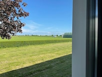 View of part of the airfield from the bedroom